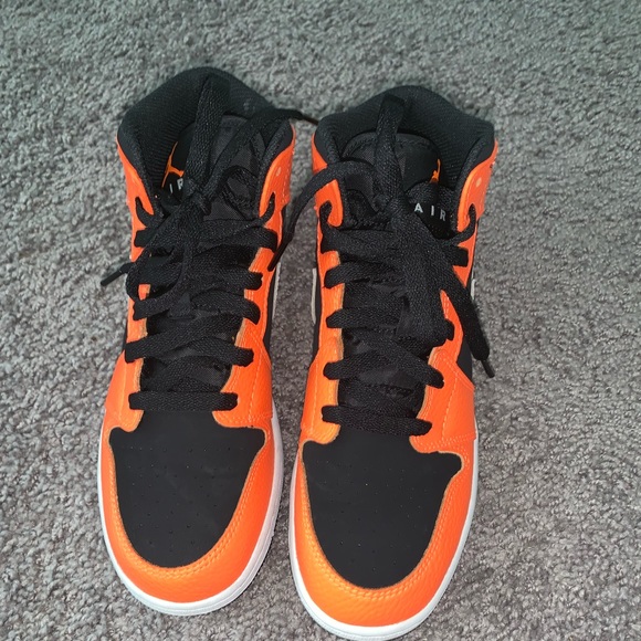 Orange black and white Air Jordan mid (gs)